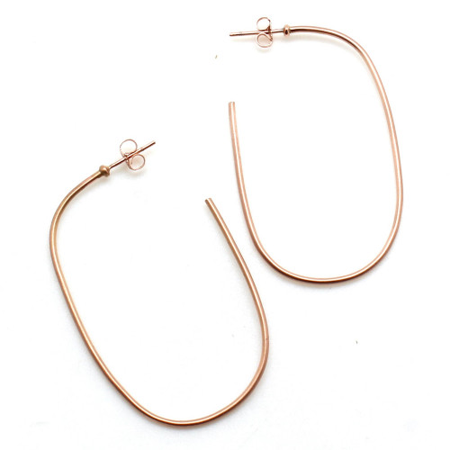 These 14k rose gold ellipse shaped hoops with a satin finish. They measure 5cm in length and 3cm in width. The start of the earring post also features a small disc for extra support when worn. To know more details please visit here https://eyeonjewels.com/product/rose-gold-ellipse-hoops-19506