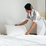 Hotel-maid-fluffing-pillows-768x513-2