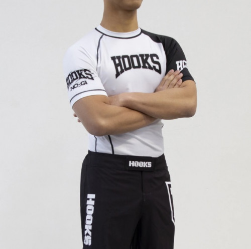 If you are looking to find the best BJJ rash guards available in the market, look no further. Hooks Jiu-Jitsu is the premier seller of Jiu Jitsu rash guards in Australia. We are constantly tweaking the materials and fit looking for the perfect rash guard. Perfect for no-gi BJJ and MMA, our Jiu Jitsu rashguard features advanced fabrics that adapt to the body with the perfect balance of elasticity to wick away moisture and keep you comfortable. Discover the best men's, women's, and kid's rash guards today. Our jiu jitsu rash guard range is made especially for the everyday grappler. A rashguard is known as effective as a compression top for muscle protection, even as you proceed through strenuous grappling. Designed with your training in your mind, this durable rash guard is an incredible fusion of style and comfort. Additionally, it is flexible and durable, making it perfect for grappling. Our BJJ rashguards are hard wearing, moisture wicking and of great quality. Available in IBJJF compliant colors. Order today! Visit https://hooksbrand.com/collections/rashguards