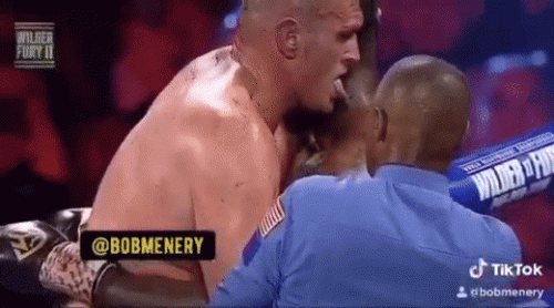 Tyson Fury licking Deontay Wilder(2)